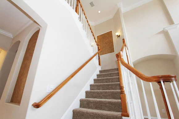 Carpet installed on a flight of staircases by Mucking Around with Carpet in a residential home in Auckland.